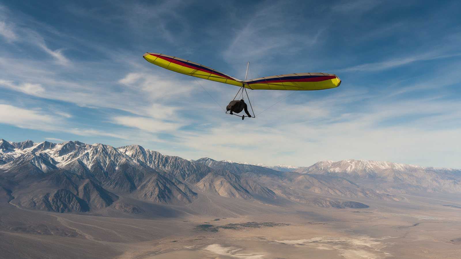Hang glider flying high over the Owens Valley between the Sierra Nevada and the White Mountains