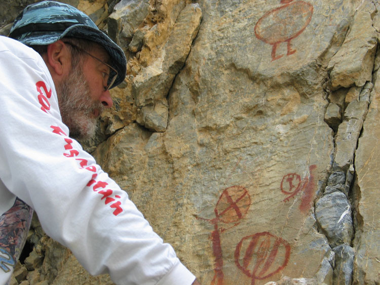 Ernie gets up close to the petroglyphs